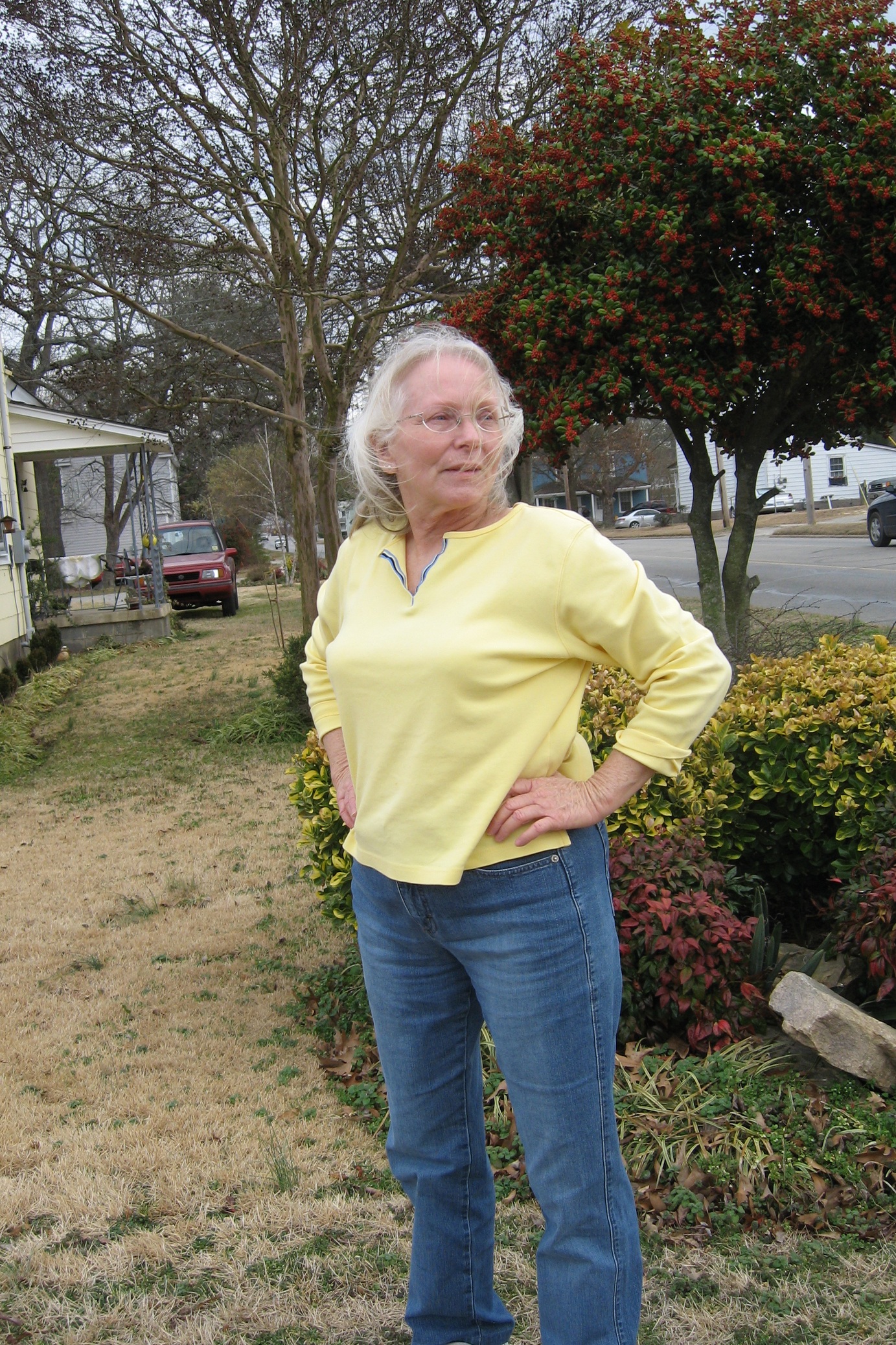 Shelia standing outdoors in her yard and garden